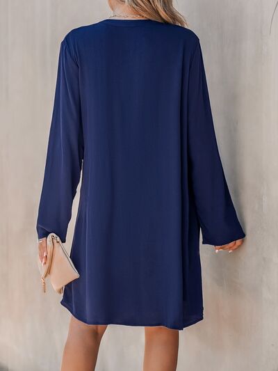 Robe plissée demi-boutonnée à col rond grande taille
